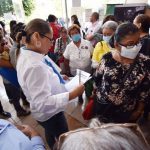 Families of missing persons line up to see if they can identify clothing and other articles found in hidden graves.
