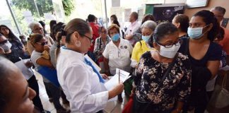 Families of missing persons line up to see if they can identify clothing and other articles found in hidden graves.