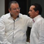 Capella, left, and Governor González.