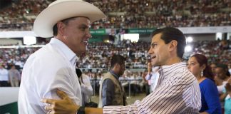 Sandoval, left, and President Enrique Peña Nieto in an undated photo.