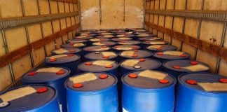 Drums of suspected synthetic drug precursor discovered after seatbelt infraction.