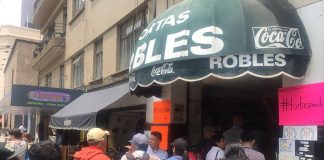Supporters line up for a free torta at Mexico City's Tortas Robles.