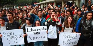 UNAM students protest Monday's aggression.