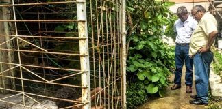 Officials at the Veracruz home in which a woman was kept in a cage.