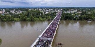 Migrants on the bridge at the Guatemala border yesterday.