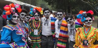 Participants wait for the start of Sunday's Day of the Dead parade in Mexico City.