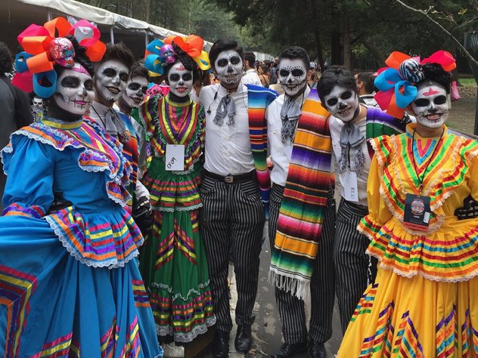 Participants wait for the start of Sunday's Day of the Dead parade in Mexico City.