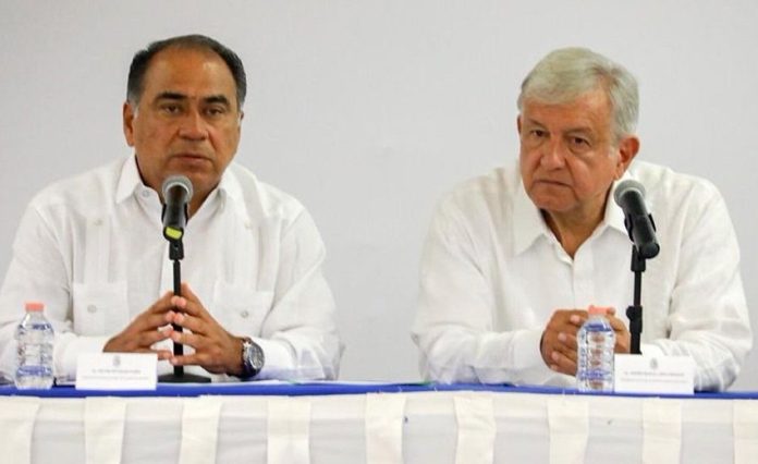 Governor Astudillo, left, and AMLO meet in Guerrero.