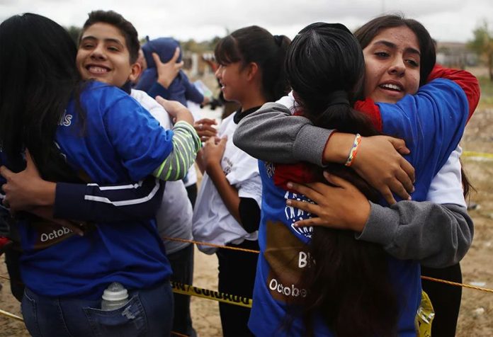 Hugs at the border.