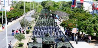 Military personnel march yesterday in Cancún to inaugurate new base.
