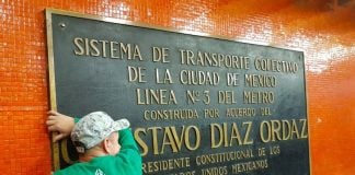 A plaque remembering Díaz Ordaz is removed in the Mexico City subway.