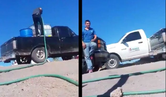A Pemex truck drives past a pipeline theft in progress in a video shot earlier this year.