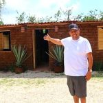 Omar Vázquez and his sargassum-adobe house.