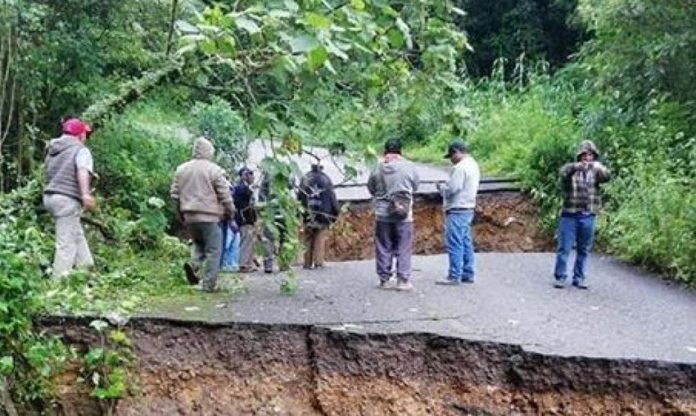 Highway damage caused by heavy rains has cut off 10 communities in Oaxaca.