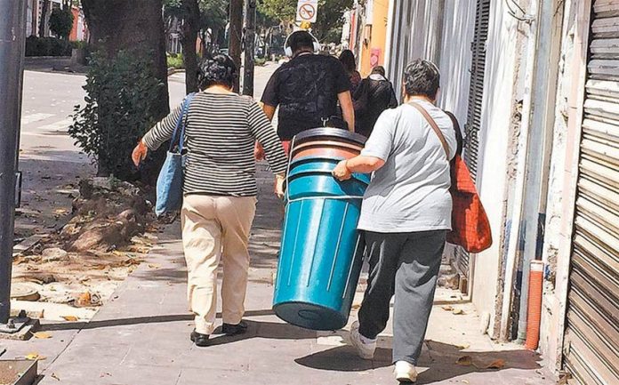 Mexico City residents stock up on water containers.