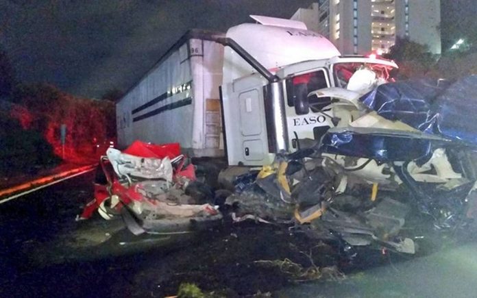 The semi amid crumpled cars after yesterday's accident.
