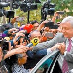 López Obrador greets fans after yesterday's airport meeting.