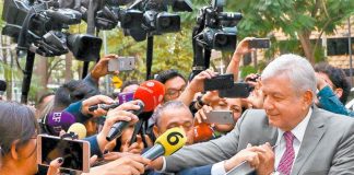 López Obrador greets fans after yesterday's airport meeting.