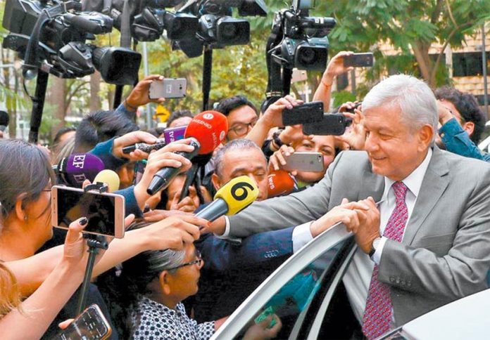 López Obrador greets fans after yesterday's airport meeting.