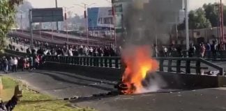 Tires burn during yesterday's highway blockade.