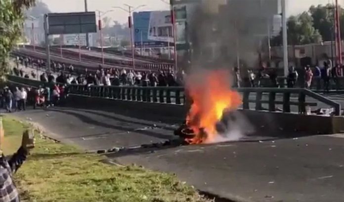 Tires burn during yesterday's highway blockade.