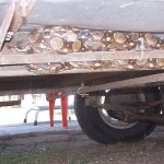 The boa constrictor trapped on a motorhome.