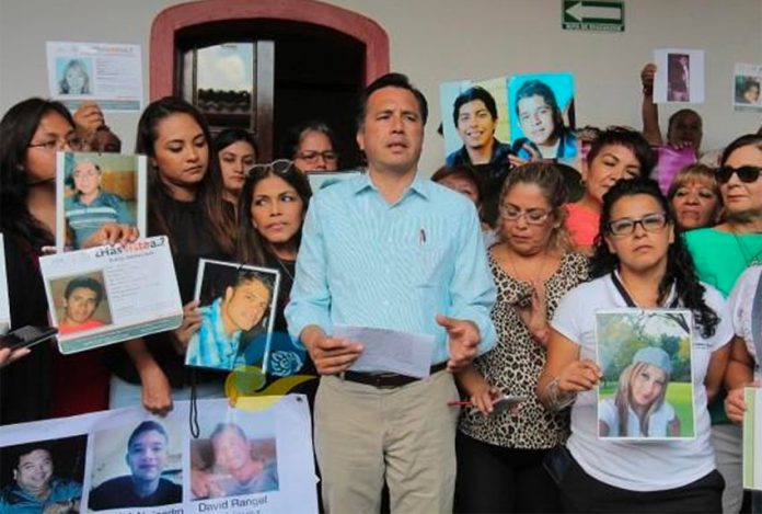 Incoming governor García and relatives of missing persons.