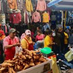 A chicharrones salesman works among thousands of vendors at the market in San Martín.