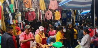 A chicharrones salesman works among thousands of vendors at the market in San Martín.