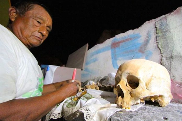 Cleaning skeletons and conversing with the dead is a Day of the Dead tradition in Campeche.