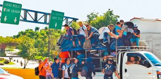 North-bound migrants arrive at Guatemala's border with Mexico.