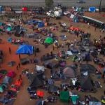 Migrants at the sports complex-shelter in Tijuana.