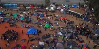 Migrants at the sports complex-shelter in Tijuana.