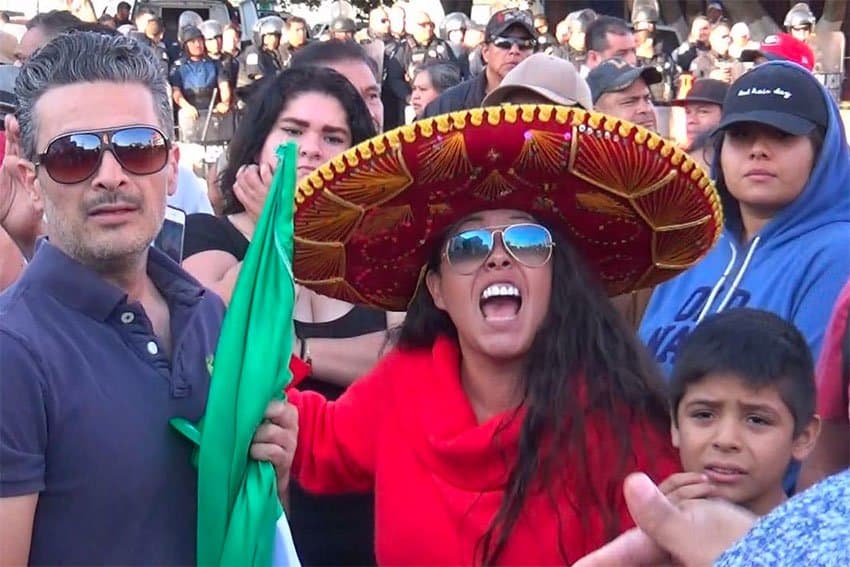 A protester voices her concern over migrants' caravan.