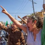 'Migrants out!' Tijuana protesters voice their disapproval over migrant arrivals.