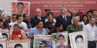 López Obrador with parents of the missing students during yesterday's signing of the decree.