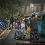 Migrants camping outside the Tijuana sports complex.