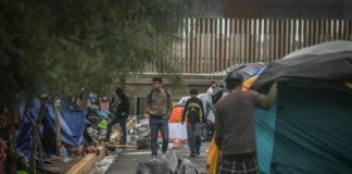 Migrants camping outside the Tijuana sports complex.