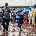 Muddy conditions at the shelter in Tijuana after heavy rains.