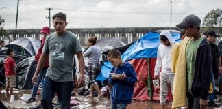Muddy conditions at the shelter in Tijuana after heavy rains.
