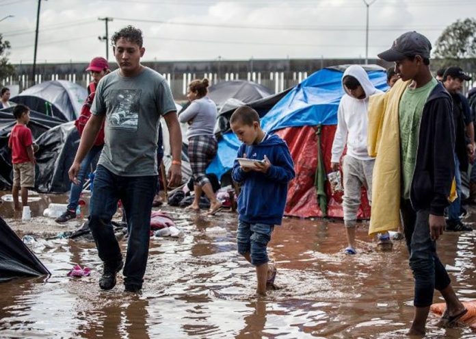Muddy conditions at the shelter in Tijuana after heavy rains.