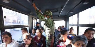 A member of the new National Guard on patrol on Puebla city public transit.