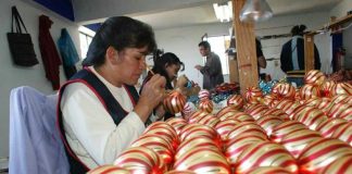 Artisans at work decorating ornaments in Tlalpujahua.