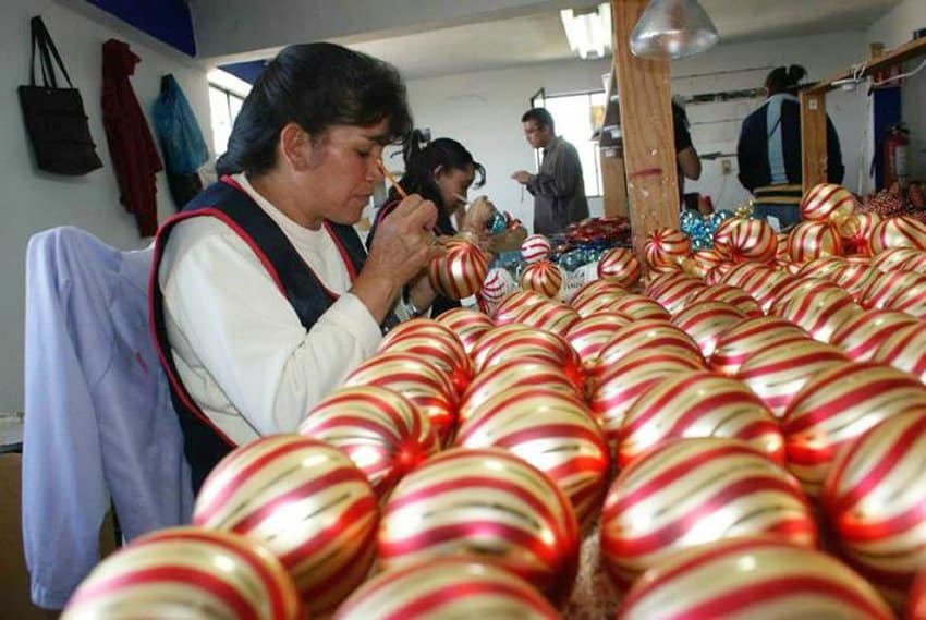 Artisans at work decorating ornaments in Tlalpujahua.