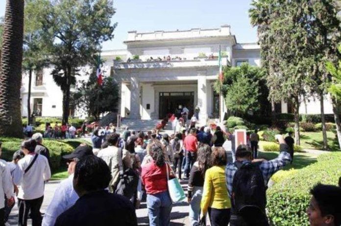 Visitors line up to tour the former presidential mansion, Los Pinos.