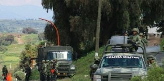 Soldiers on the lookout for pipeline thieves in San Martín Texmelucan, Puebla.