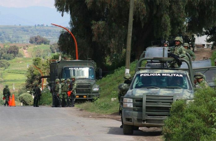 Soldiers on the lookout for pipeline thieves in San Martín Texmelucan, Puebla.