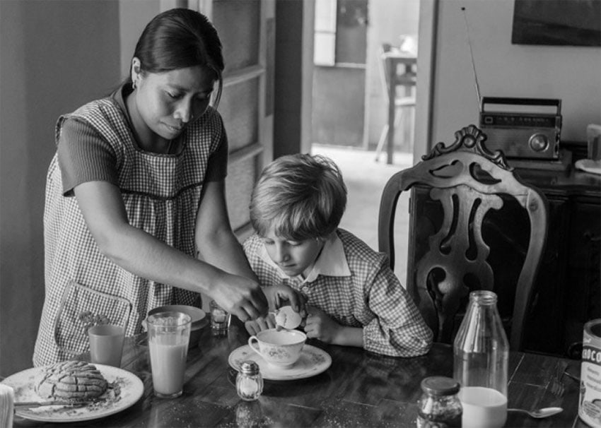 Yalitza Aparicio as Cleo with one of the children in her care.