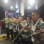 A brass band entertains motorists in Morelia early Wednesday morning.