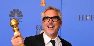 Director Cuarón and his two Golden Globe awards.
